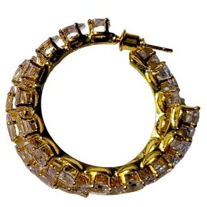 Elegant gold hoop earrings featuring dazzling zircon stones